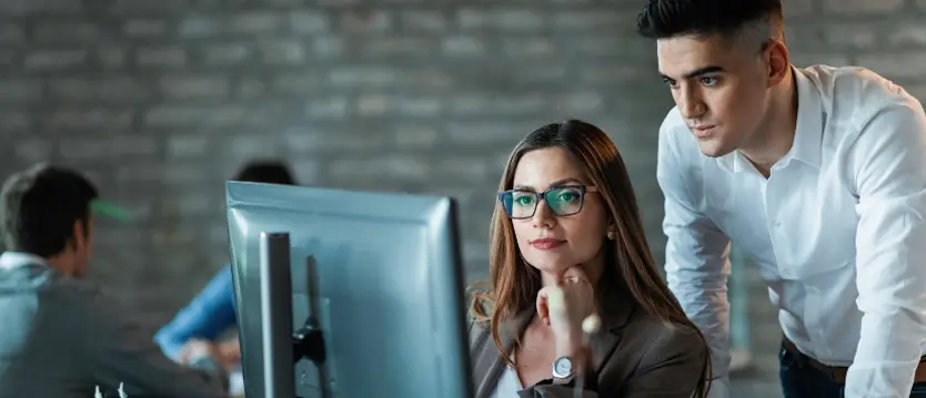 two people checking the computer